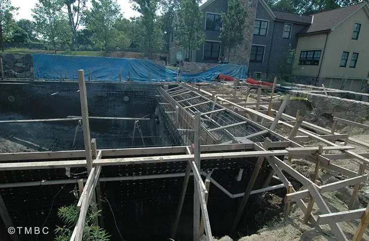 Beach entry pool design with stonework, spa, and water feature details image 6