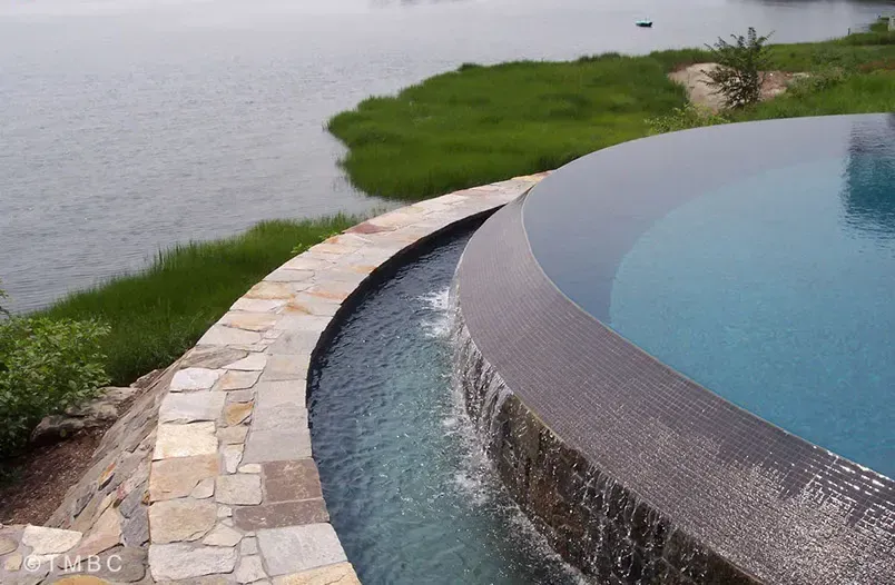 Custom pool design, spa, water feature, and outdoor living environment image 2