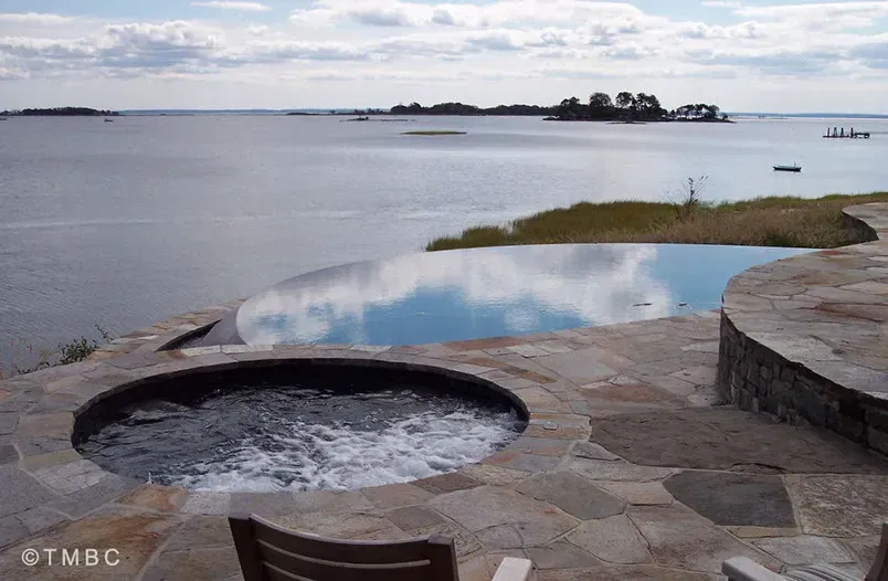 Custom pool design, spa, water feature, and outdoor living environment image 3