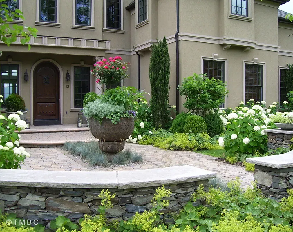 Nouveau Mediterranean landscape design with stonework, pottery, and courtyard planting image 3