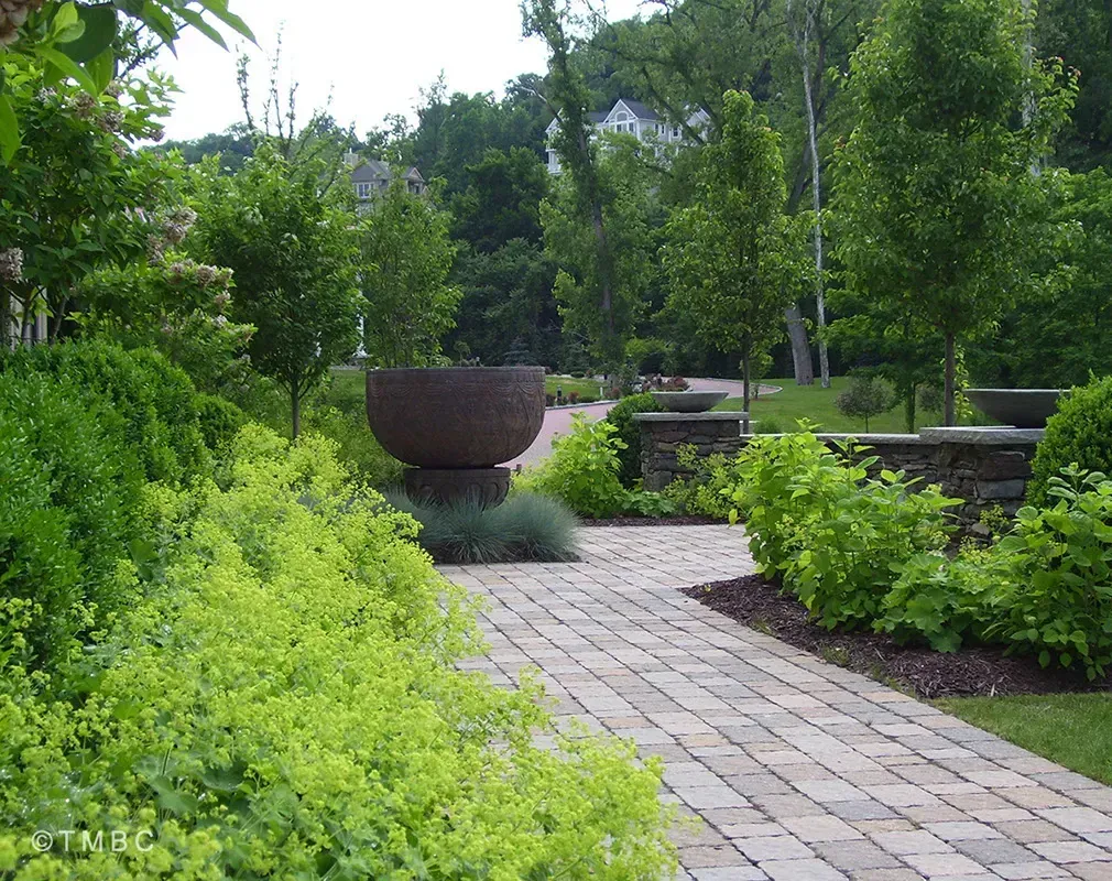 Nouveau Mediterranean landscape design with stonework, pottery, and courtyard planting image 8