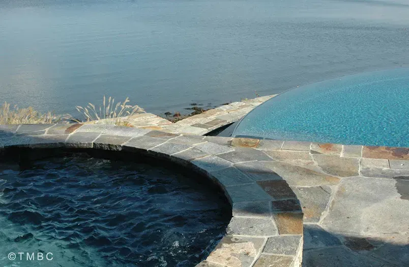 Custom pool design, spa, water feature, and outdoor living environment image 5