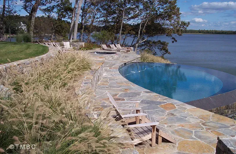 Custom pool design, spa, water feature, and outdoor living environment image 9